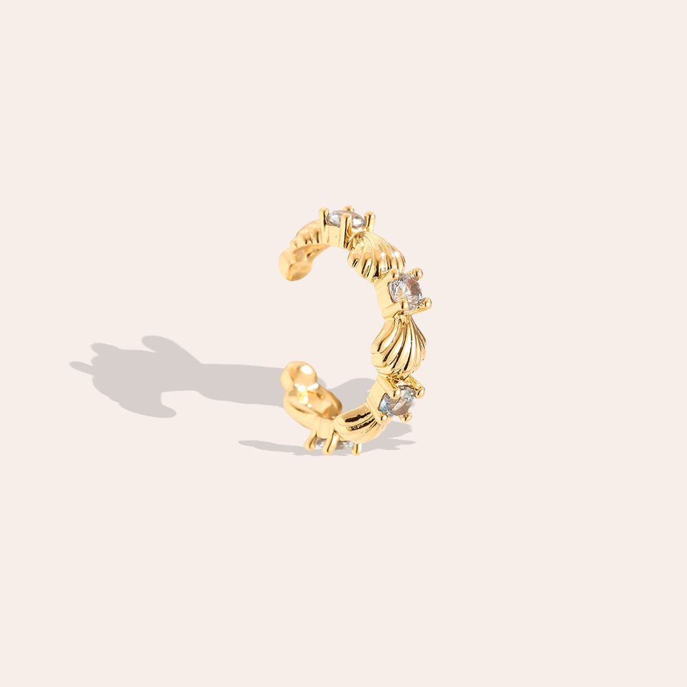 Viele Muscheln mit blauer Zirkonia Vergoldete Ear-Cuffs